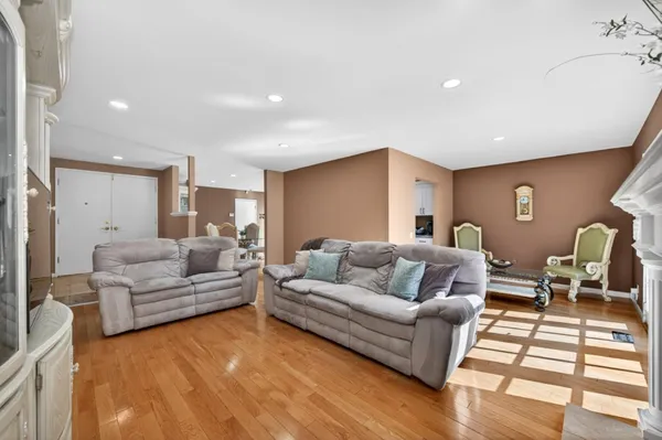 a work room with furniture and wooden floor