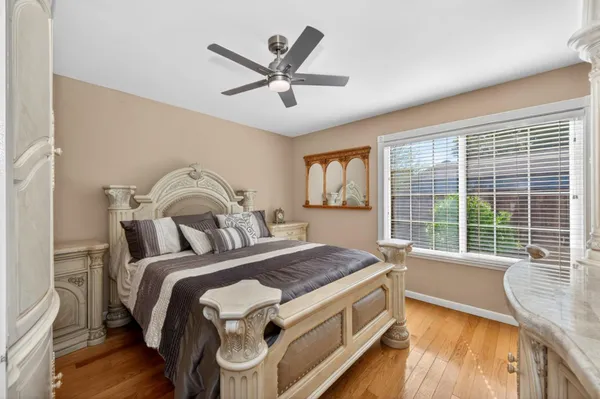 a kitchen with granite countertop white cabinets and sink
