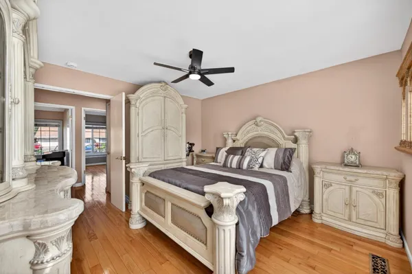 a kitchen with stainless steel appliances a stove a sink cabinets and a dining table