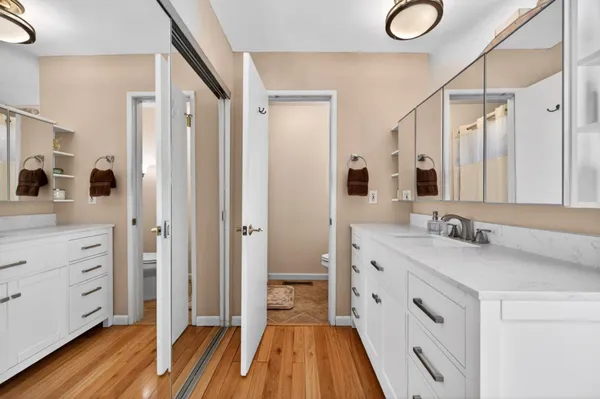 a kitchen with stainless steel appliances kitchen island granite countertop a stove and a sink