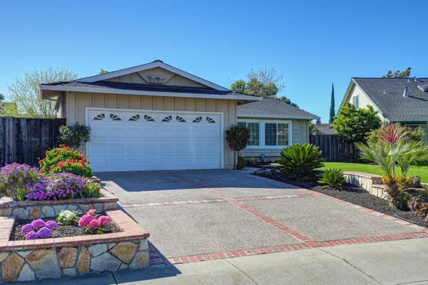 a front view of a house with a garage