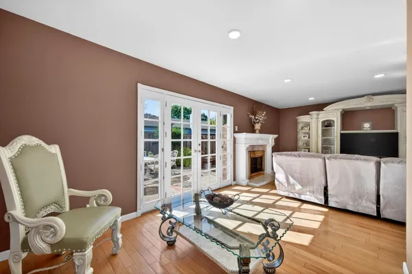 a view of a backyard with plants and wooden fence
