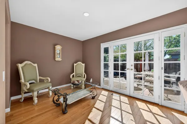 a view of garden with wooden fence