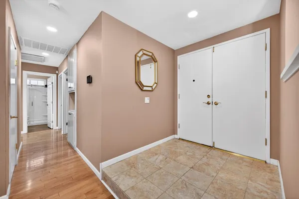 a view of a bathroom from the hallway