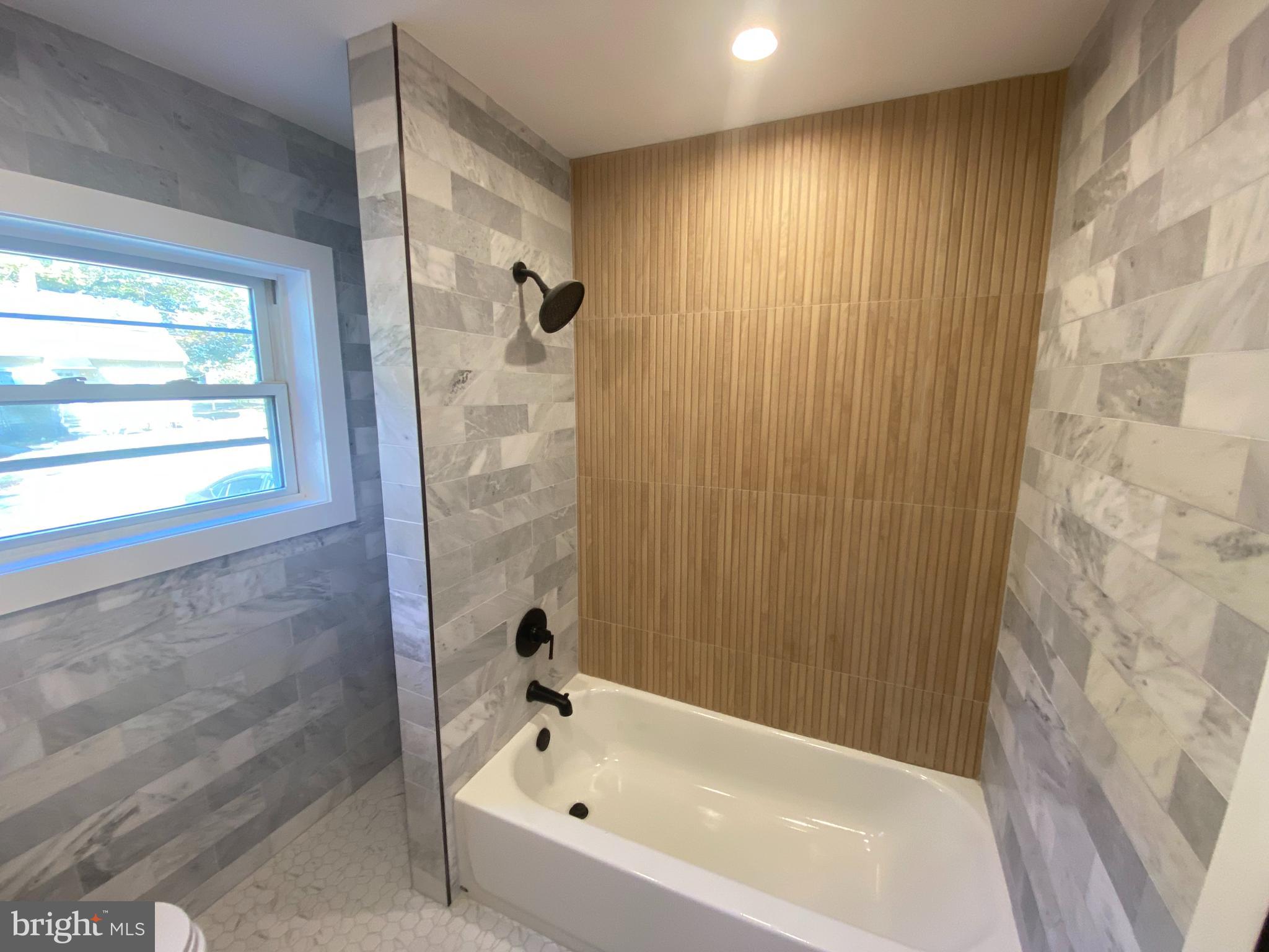 1104 Highway 77 Bridgeton, NJ 08302 - Photo 11 of 21 a bathroom with a bathtub and shower