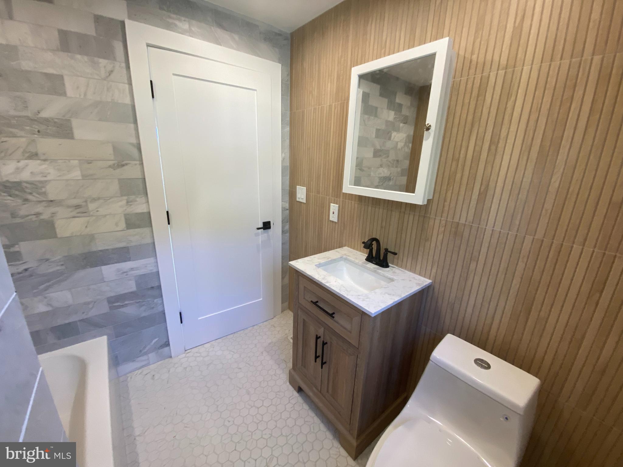 1104 Highway 77 Bridgeton, NJ 08302 - Photo 12 of 21 a bathroom with a granite countertop sink and a mirror