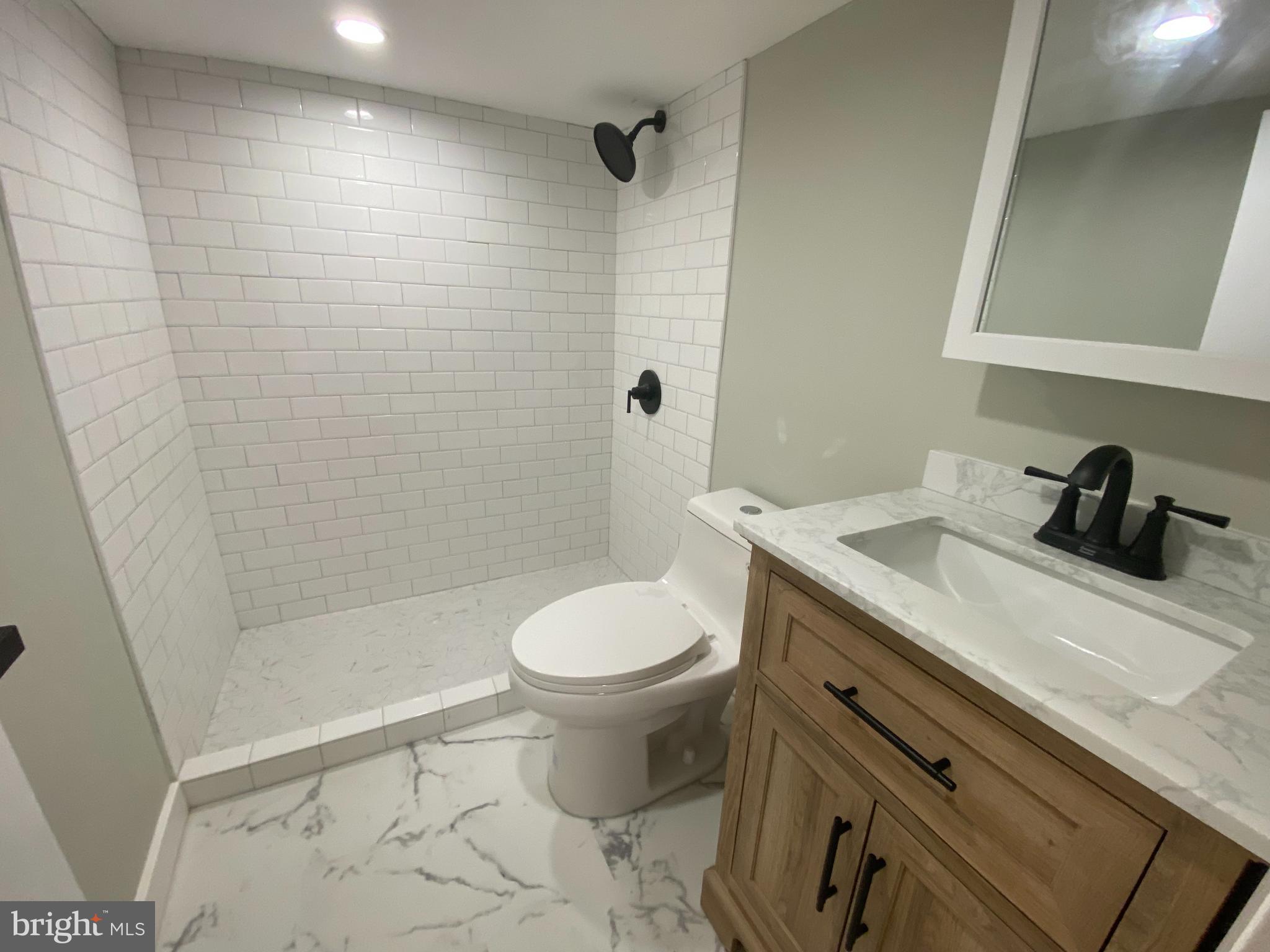 1104 Highway 77 Bridgeton, NJ 08302 - Photo 20 of 21 a bathroom with a sink a toilet and shower