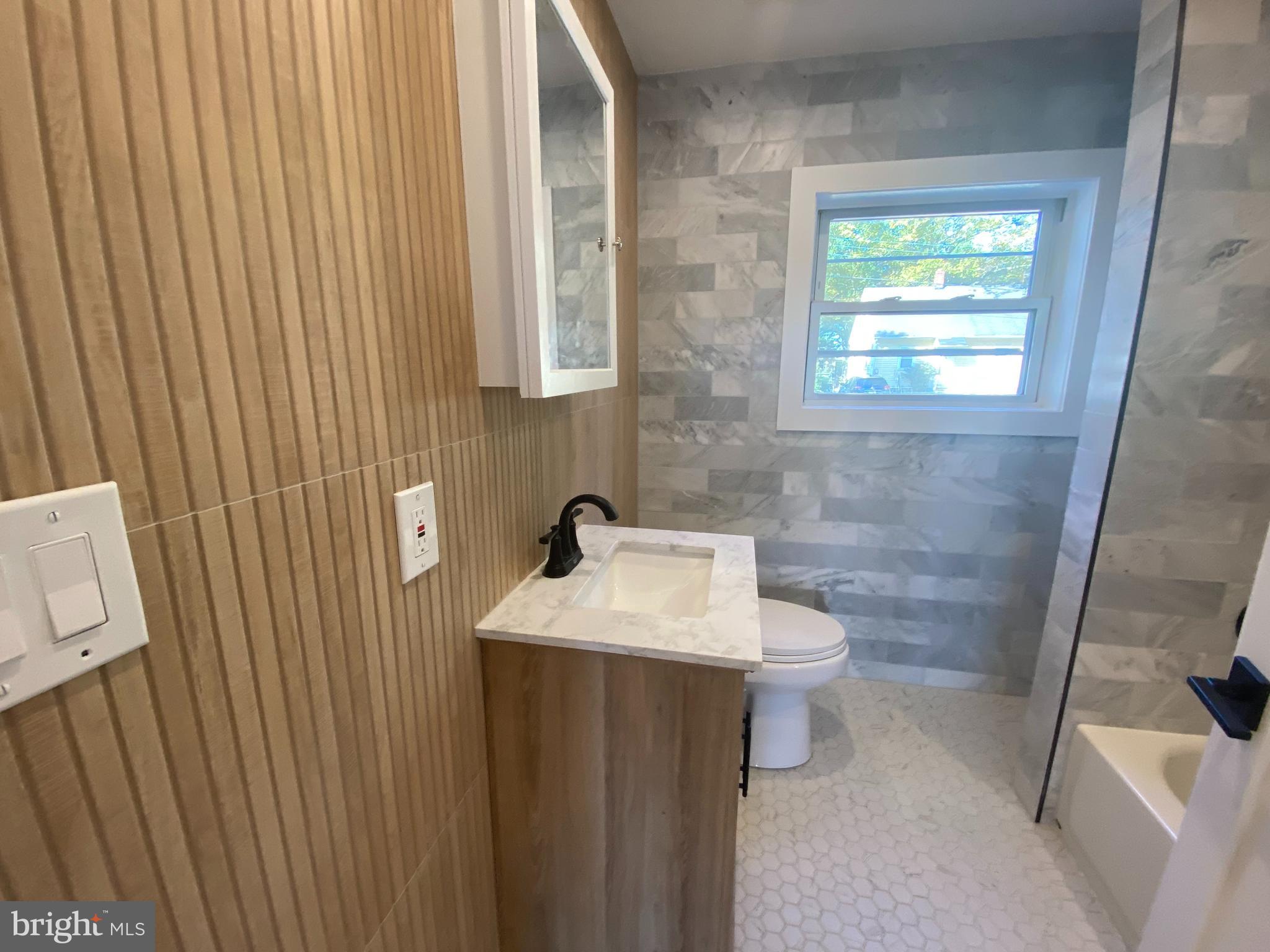 1104 Highway 77 Bridgeton, NJ 08302 - Photo 9 of 21 a bathroom with a sink a toilet and mirror