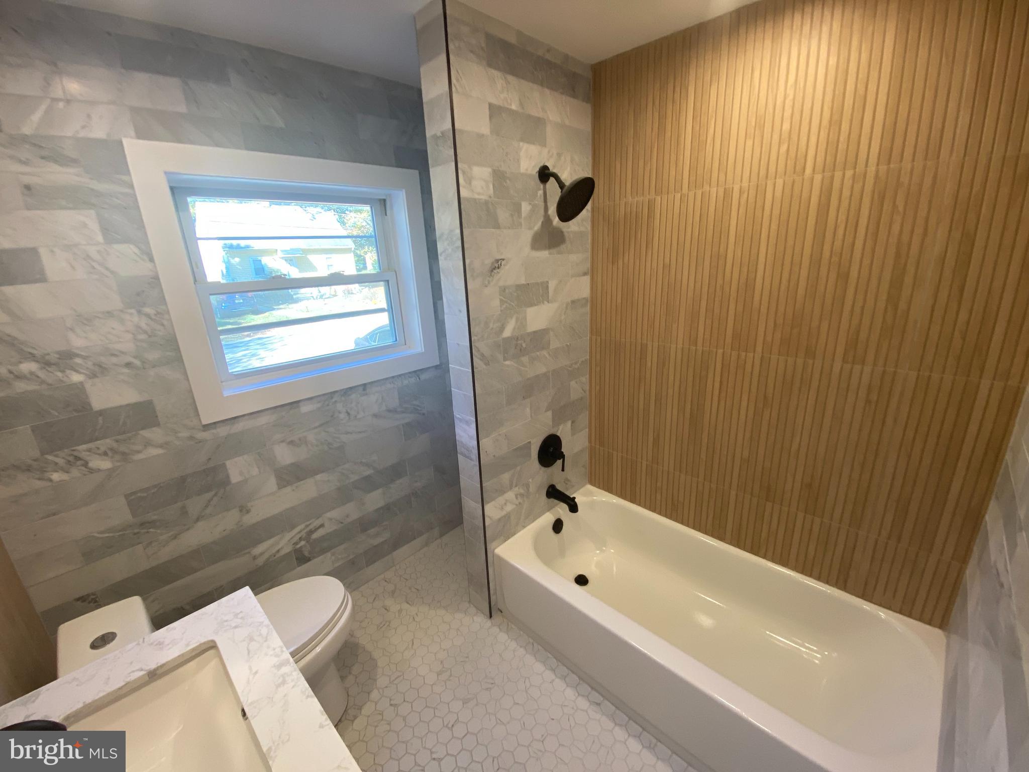 1104 Highway 77 Bridgeton, NJ 08302 - Photo 10 of 21 a bathroom with a bathtub and a shower
