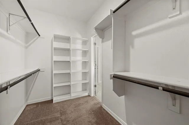 a view of an empty walk in closet