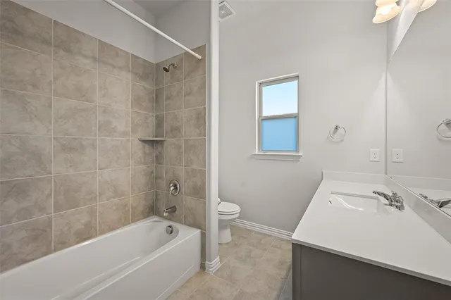 a bathroom with a bathtub and a sink