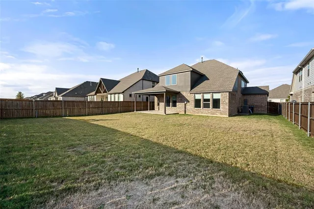 a front view of house with yard and seating area