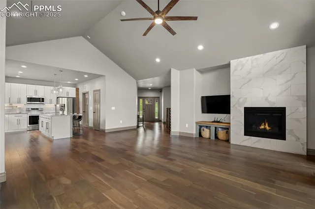 a view of kitchen with furniture and a flat screen tv