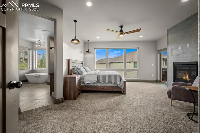 a bedroom with furniture and a fireplace