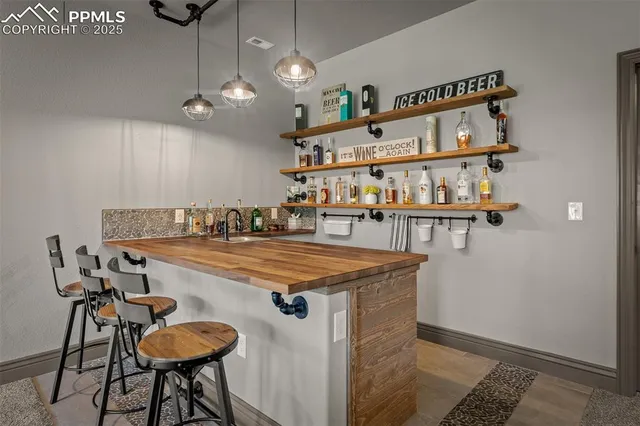 a room with furniture a chandelier and a table