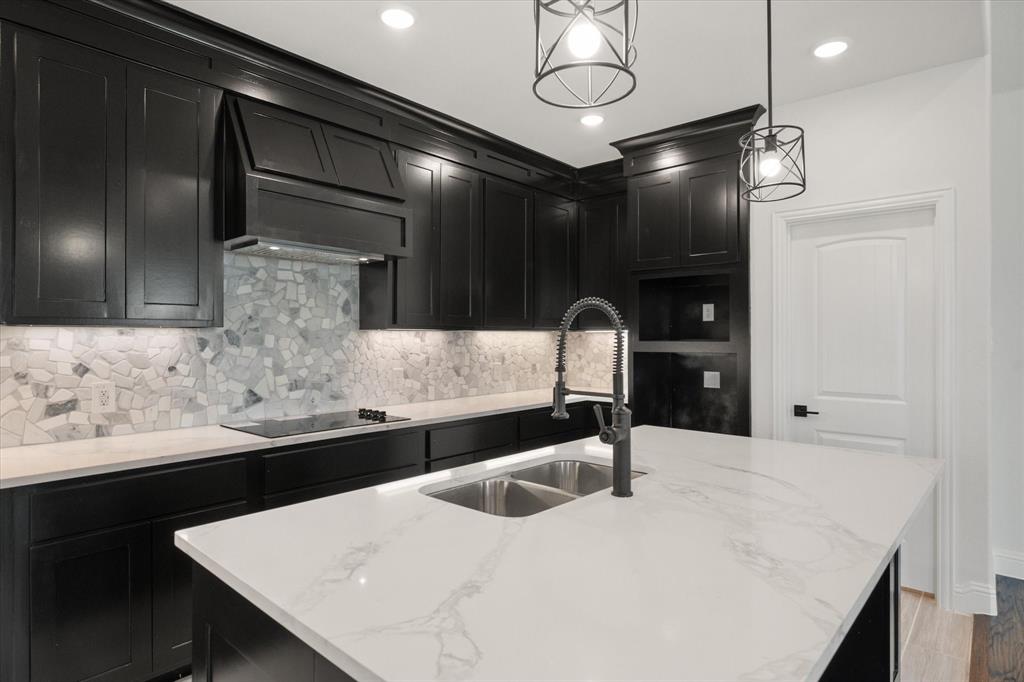 3400 Dobbins Road Corsicana, TX 75110 - Photo 11 of 40 a kitchen with stainless steel appliances kitchen island granite countertop a sink and cabinets