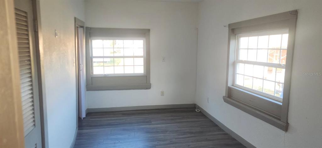 1330 Pine Street Altamonte Springs, FL 32701 - Photo 8 of 13 an empty room with wooden floor and windows