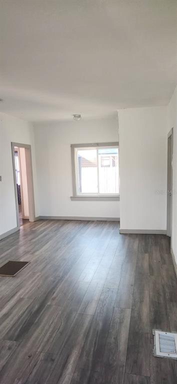 1330 Pine Street Altamonte Springs, FL 32701 - Photo 9 of 13 a view of an empty room with wooden floor and window