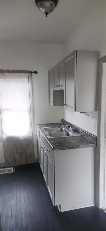 1330 Pine Street Altamonte Springs, FL 32701 - Photo 10 of 10 a kitchen with granite countertop a stove and a sink