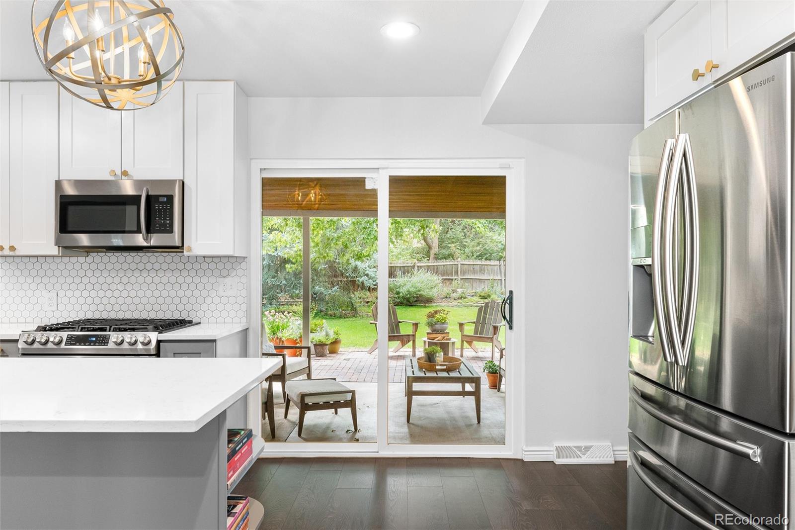 6149 South Elizabeth Way Centennial, CO 80121 - Photo 16 of 49 a kitchen with a large window appliances and cabinets
