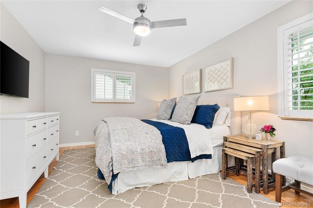 a bed room with furniture and a flat screen tv