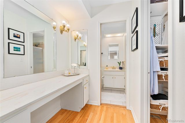 a spacious bathroom with a double vanity sink and a mirror