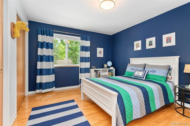 a bedroom with bed and a window