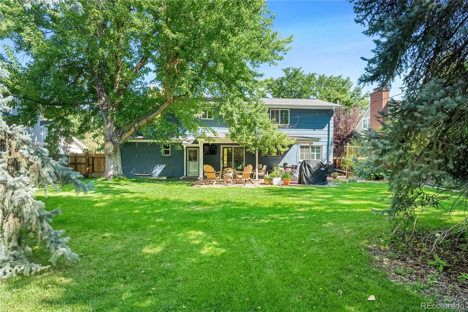 6149 South Elizabeth Way Centennial, CO 80121 - Photo 3 of 49 a front view of house with yard and green space