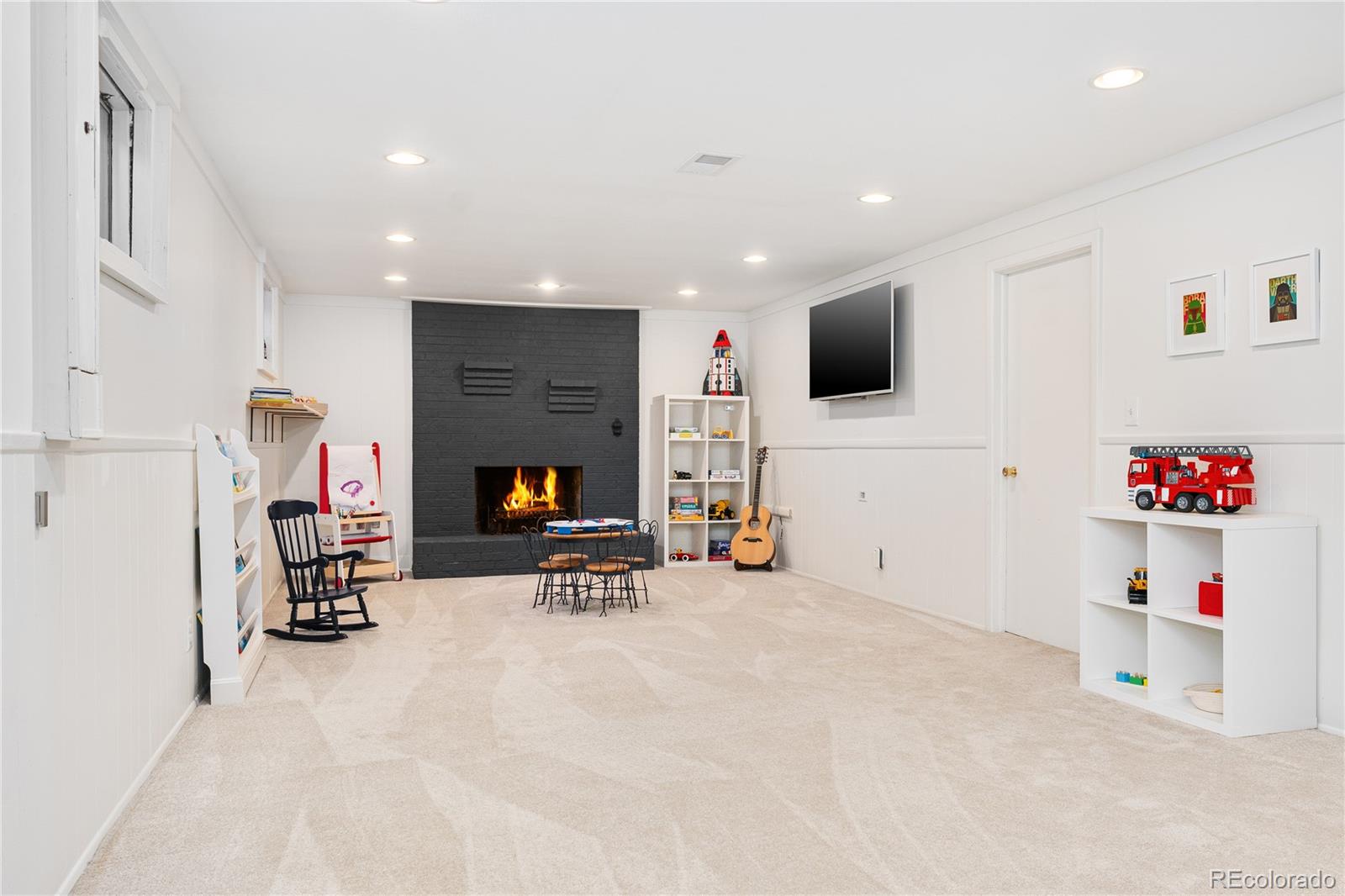 6149 South Elizabeth Way Centennial, CO 80121 - Photo 31 of 49 a view of room with furniture and a flat screen tv