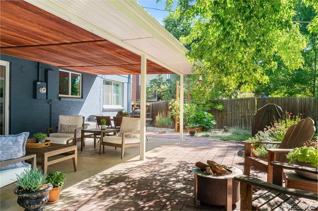a patio with table and chairs