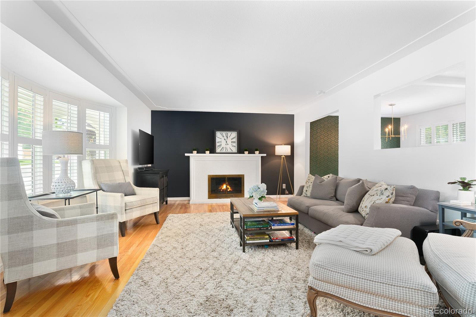 6149 South Elizabeth Way Centennial, CO 80121 - Photo 5 of 49 a living room with furniture and a fireplace