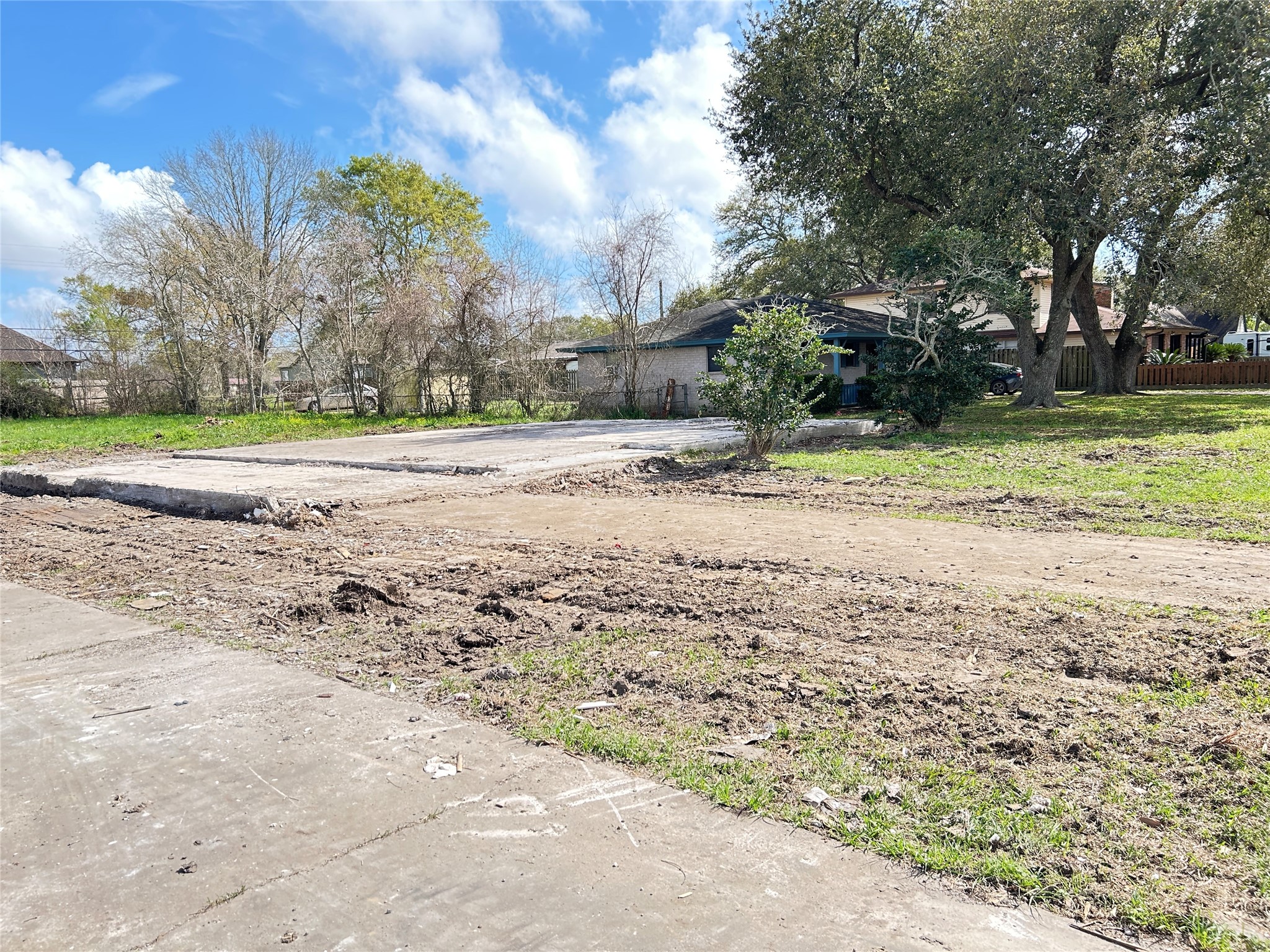 145 Blueberry Street Bridge City, TX 77611 - Photo 1 of 9 a view of a yard with plants and large trees