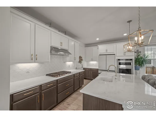 a kitchen with stainless steel appliances granite countertop a sink counter space cabinets and stainless steel appliances