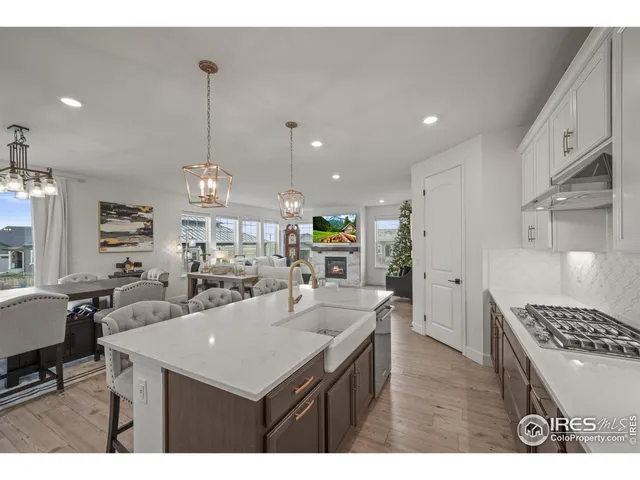 a kitchen with a counter top space appliances and cabinets