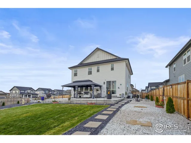 a view of a swimming pool with outdoor seating