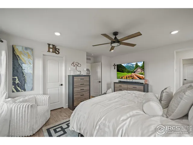 a bedroom with a bed and a cabinets