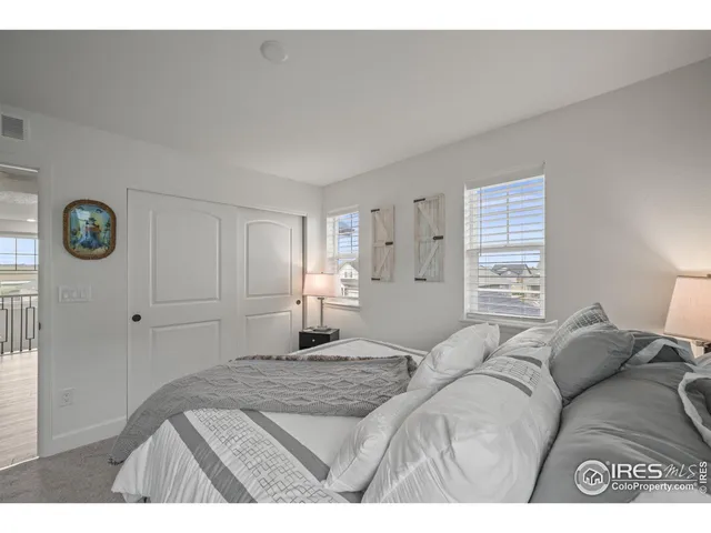 a bathroom with a double vanity sink mirror and shower