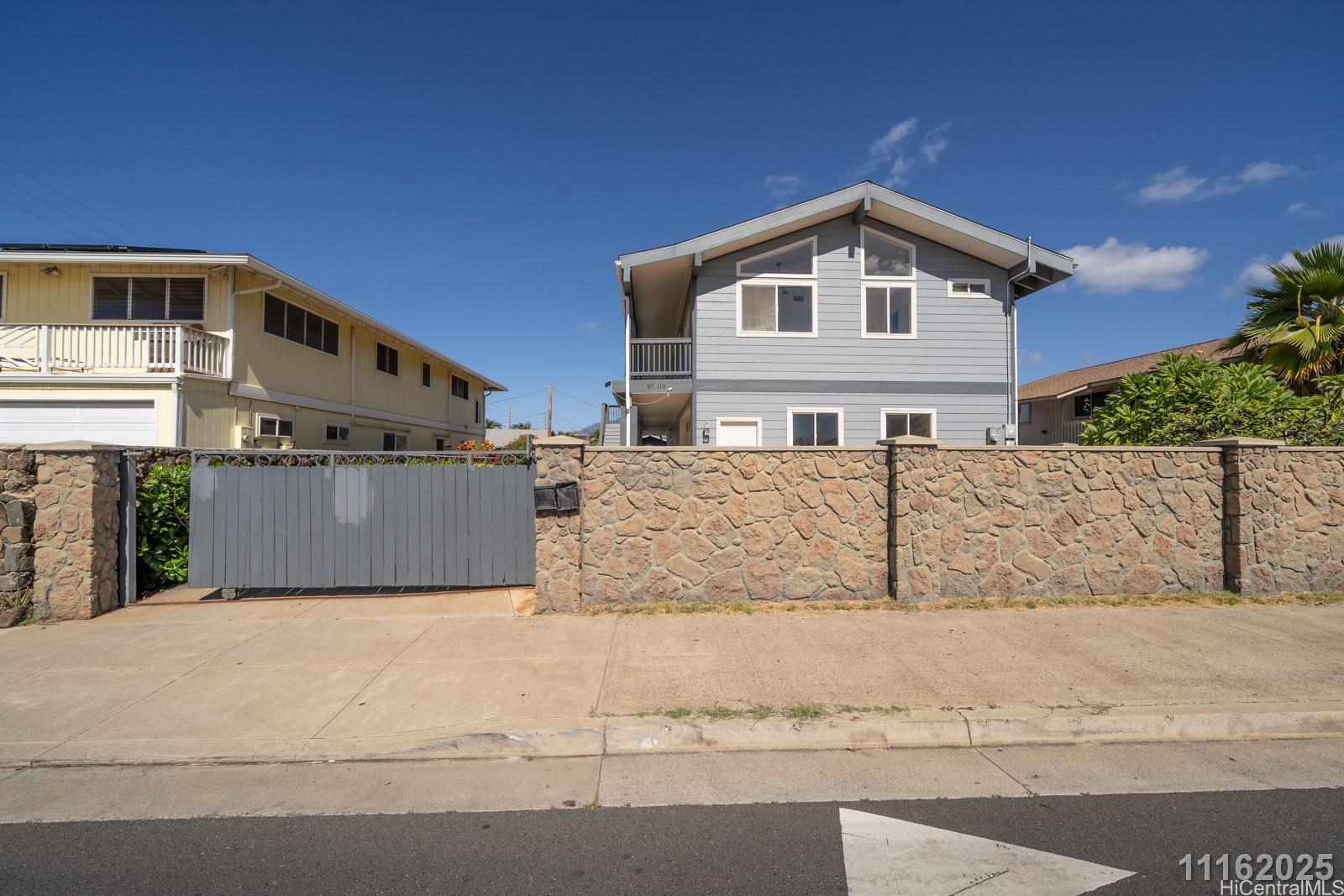 87-110 Kaukama Road, Unit B Waianae, HI 96792 - Photo 2 of 24 a front view of a house with large trees