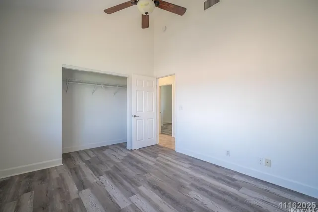 a bathroom with a granite countertop sink a mirror and a bathtub