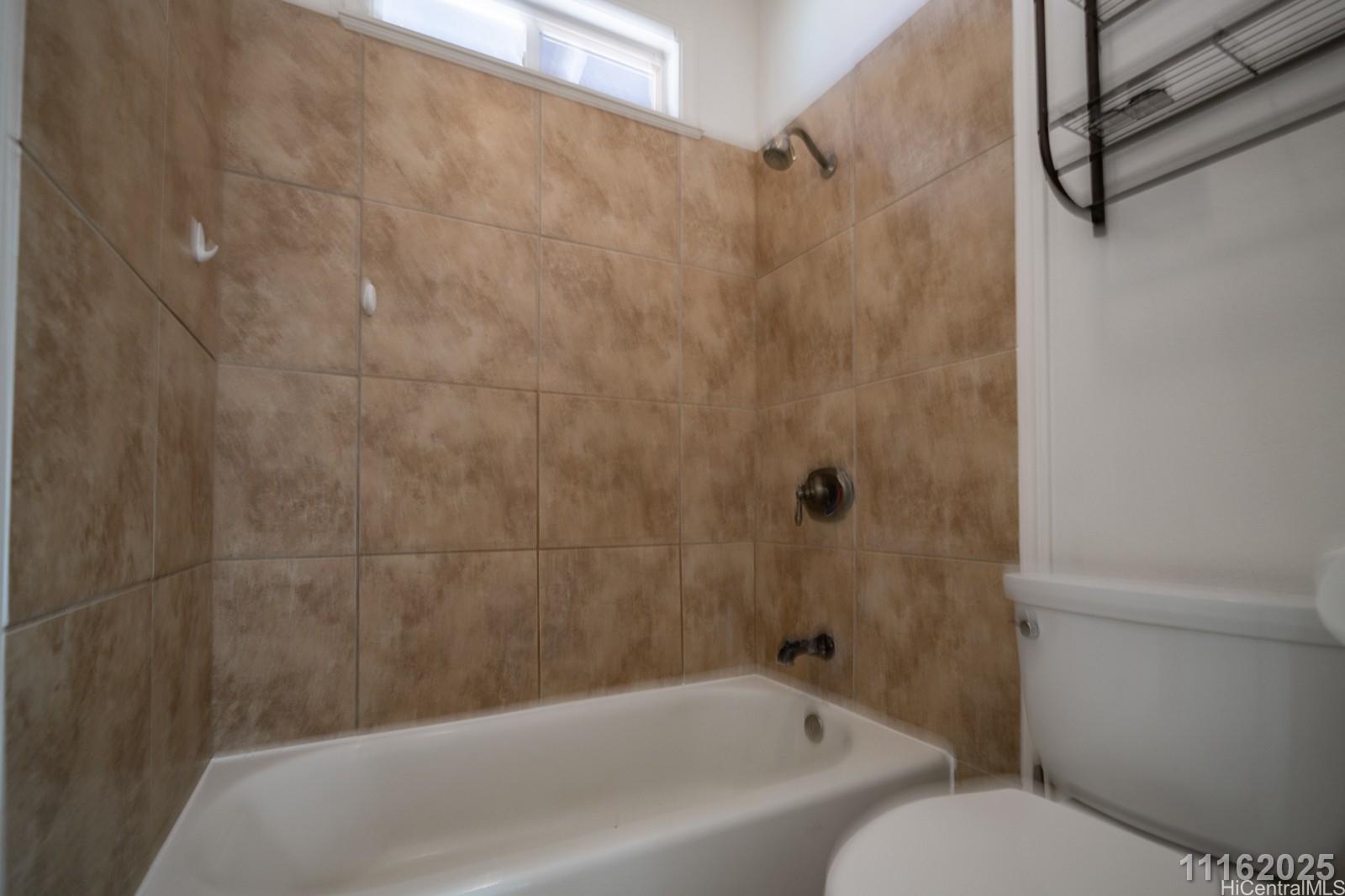 87-110 Kaukama Road, Unit B Waianae, HI 96792 - Photo 24 of 24 a bathroom with a bathtub and shower