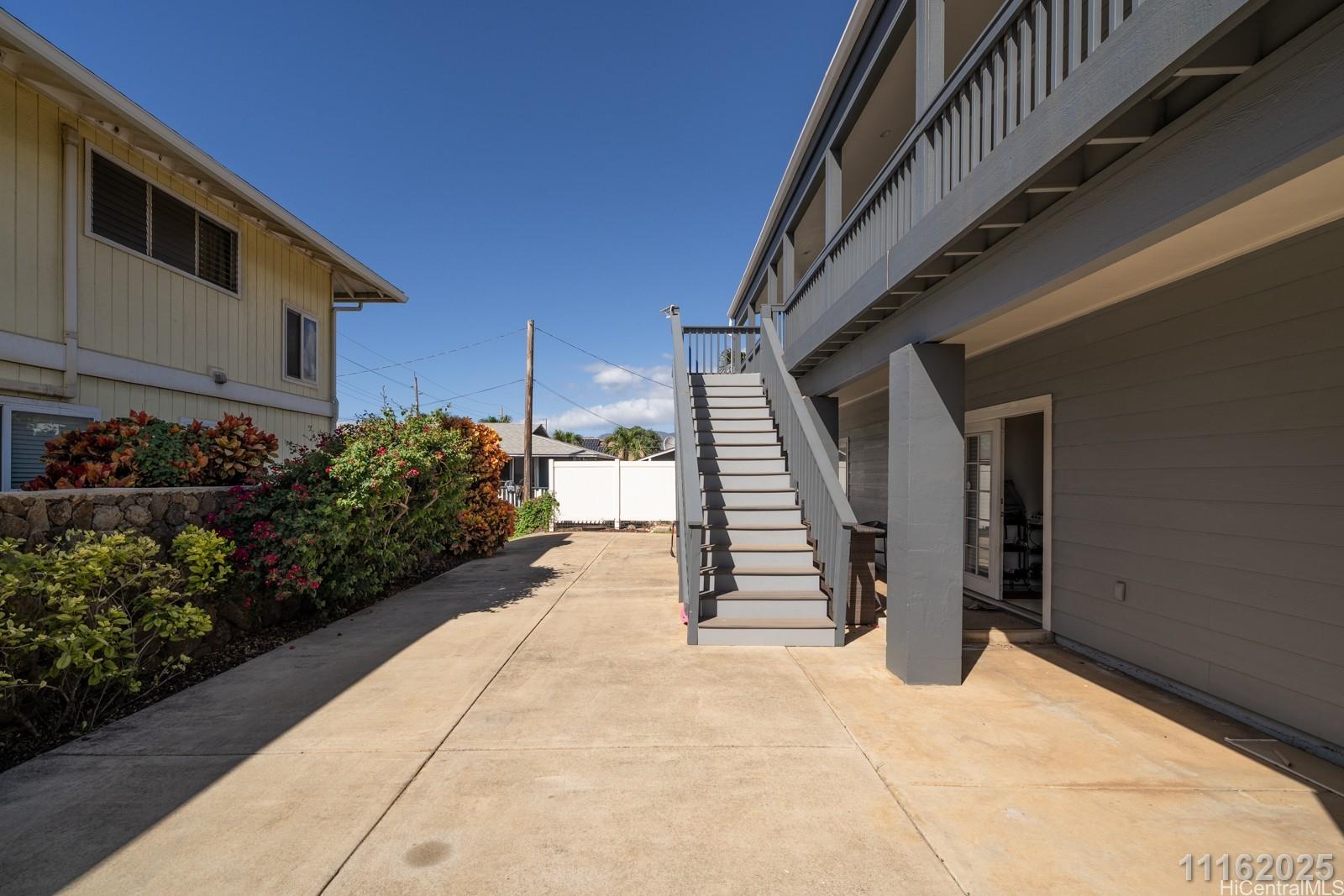 87-110 Kaukama Road, Unit B Waianae, HI 96792 - Photo 5 of 24 a view of entryway with flower pots