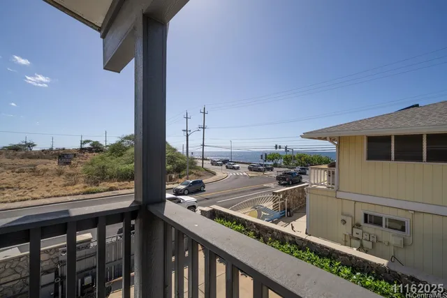 a view of a balcony with wooden floor