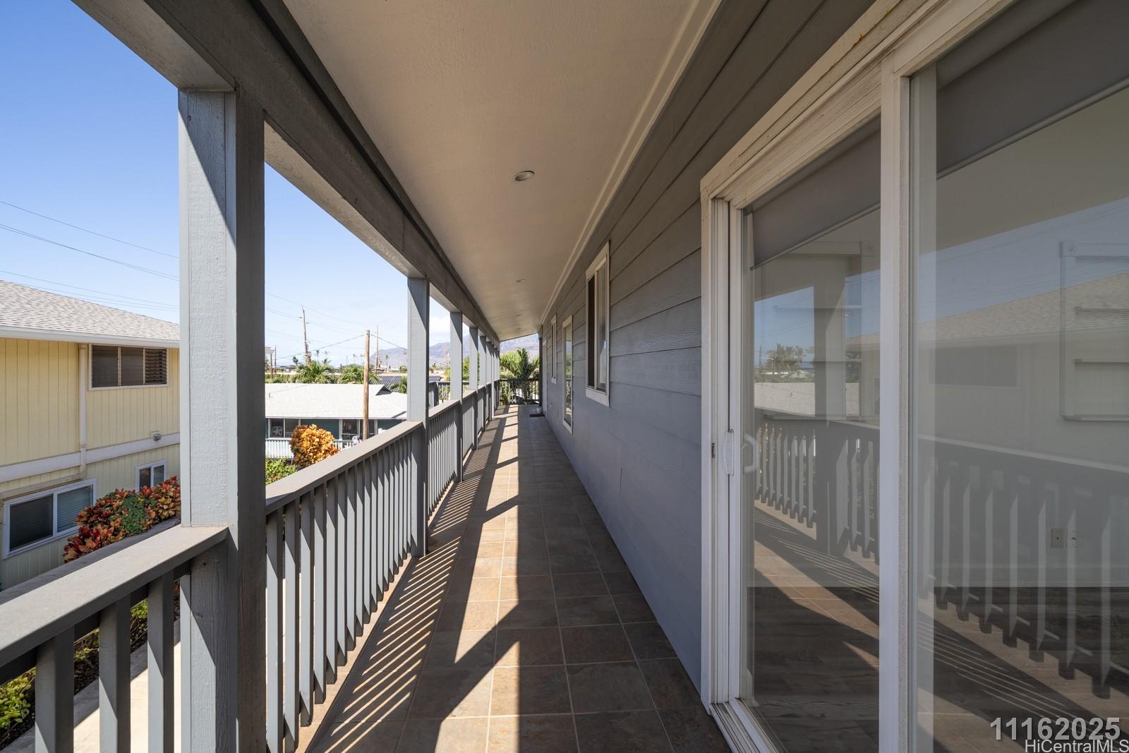 87-110 Kaukama Road, Unit B Waianae, HI 96792 - Photo 10 of 24 a view of a balcony with wooden floor