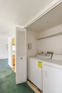 a kitchen with a stove a sink and a refrigerator
