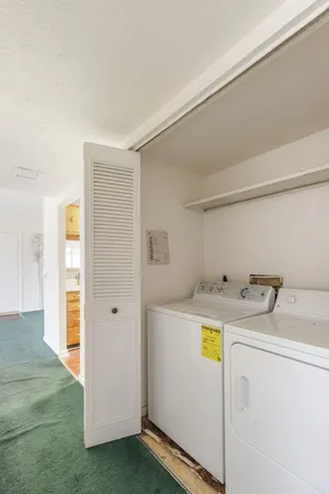 a kitchen with a stove a sink and a refrigerator