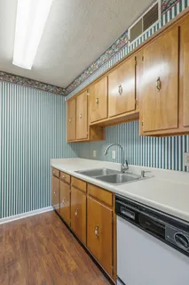 a kitchen that has a sink and a stove
