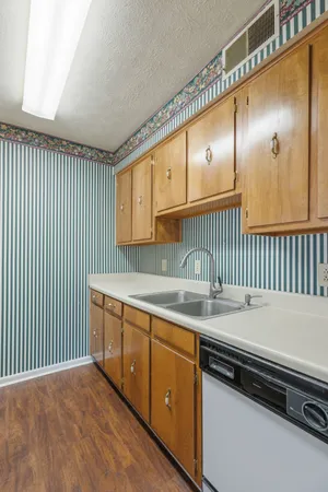a kitchen that has a sink and a stove