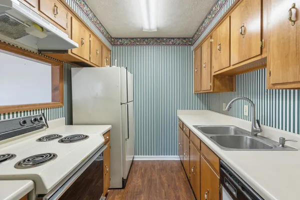 a kitchen that has a stove and a table