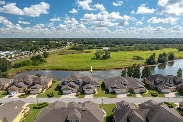 an aerial view of a houses with outdoor space