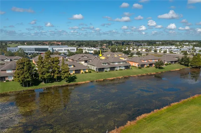 an aerial view of a houses with a yard